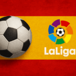 Spanish flag with the La Liga logo above and a soccer ball in the foreground.